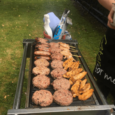 Liam cooking a private garden BBQ